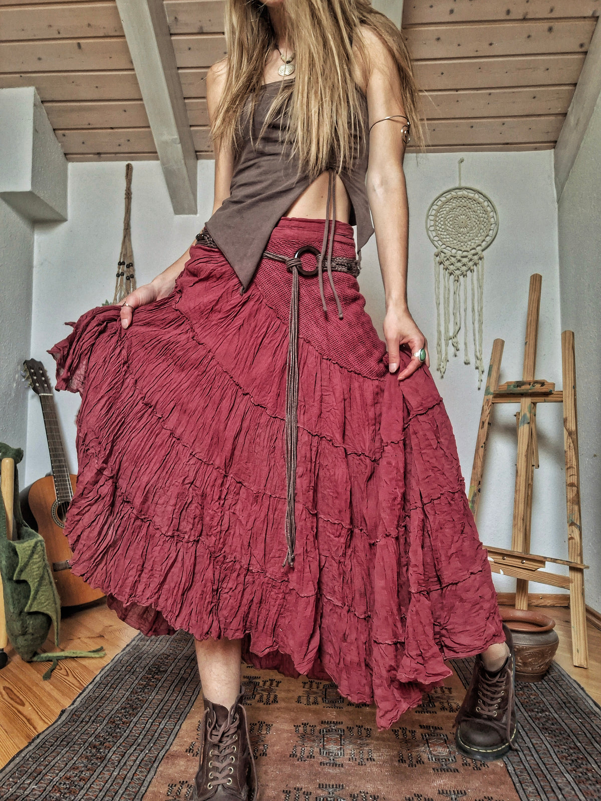 Woman wearing a long tiered handcrafted burgundy cotton maxi skirt made in India